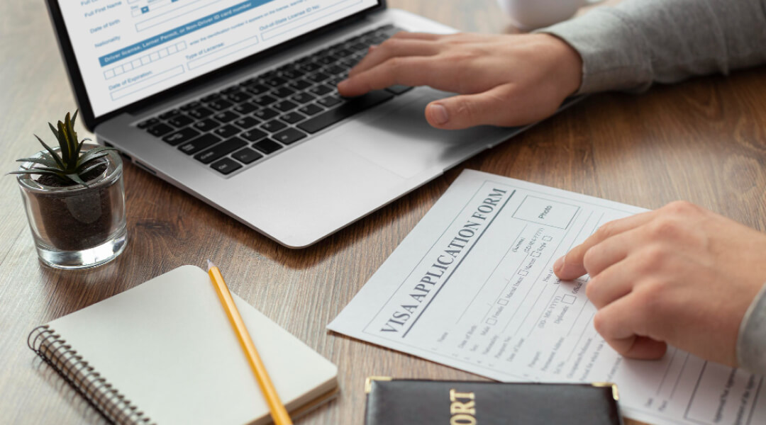 Image illustrating steps to obtain a tax refund, featuring charts, forms, and a calculator on a desk.